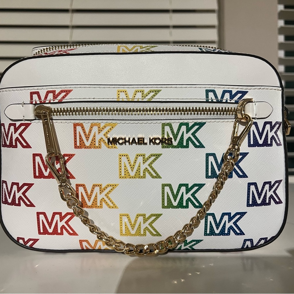 New, never used, authentic Michael Kors handbag. Rainbow logo. Gold hardware.